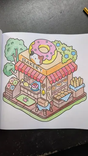 A cartoon style donut shop, painted with bright colours. The shop has a giant donut on top of it